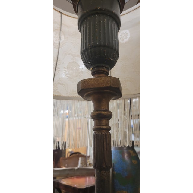 Fantastic iron and marble 1920s floor lamp with a large fringe shade. The lamp features a tall iron pole-like base in Dark...