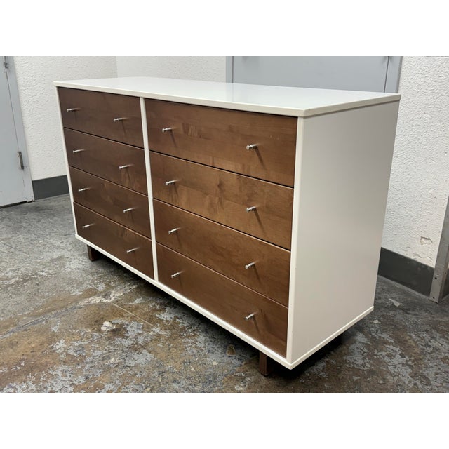 Design Plus Gallery presents a Moda Walnut Eight Drawer Dresser from Room & Board. It has walnut drawer fronts framed by a...