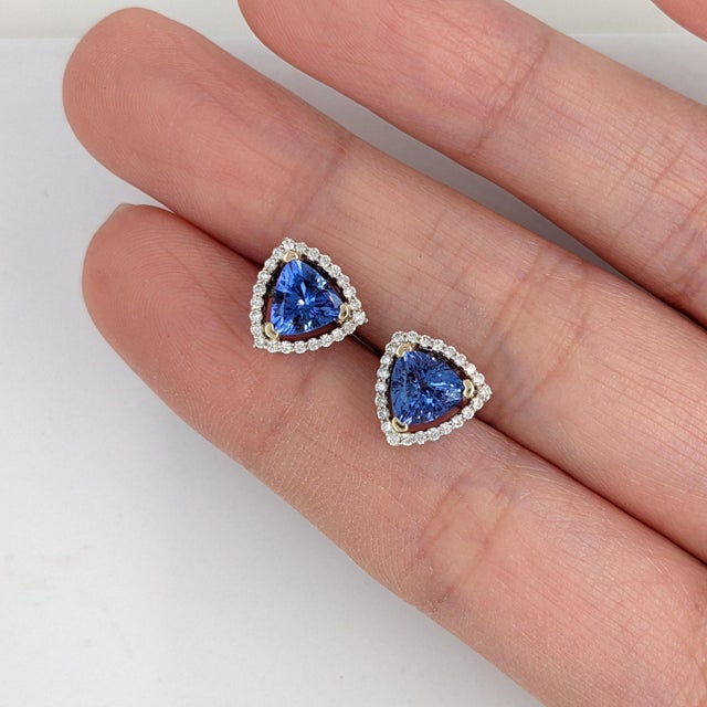 Fall for these velvety violet-blue Tanzanite stud earrings, set in solid 14K White Gold. Each earring centers a hand-...