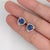 Fall for these velvety violet-blue Tanzanite stud earrings, set in solid 14K White Gold. Each earring centers a hand-...