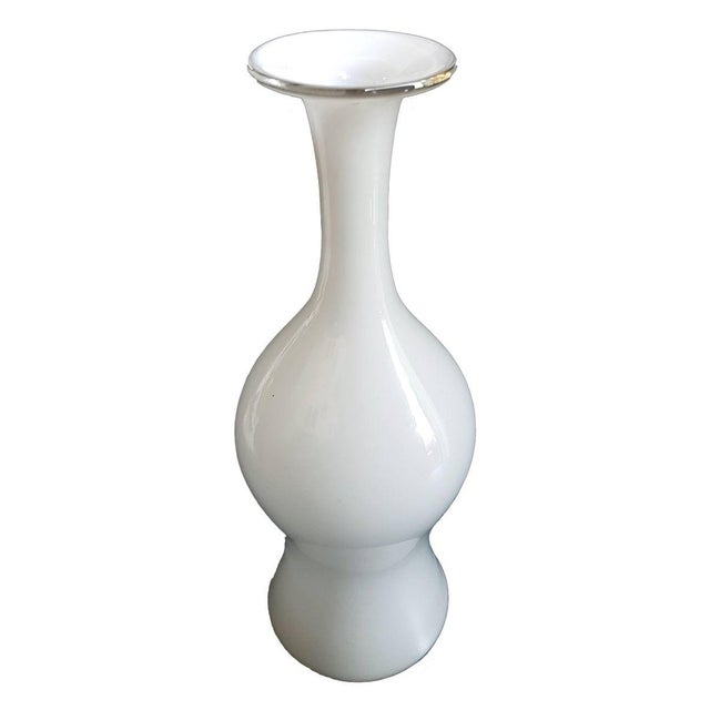 Very rare vase designed by Paolo Venini in cased glass, white and glossy, a must for Murano glass collectors. The item...