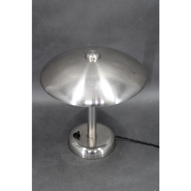 Authentic 1930s european art deco table lamp crafted in nickel plated metal. The iconic mushroom dome silhouette reflects...