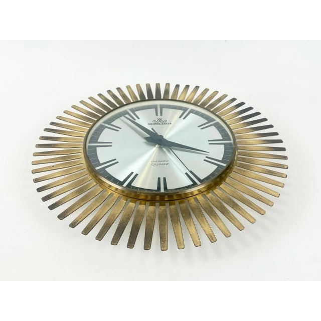Mid-Century Modern Sunburst Wall Clock in Brass from Meister Anker, 1960s, in Flawless conditions. Designed 1960 to 1969...