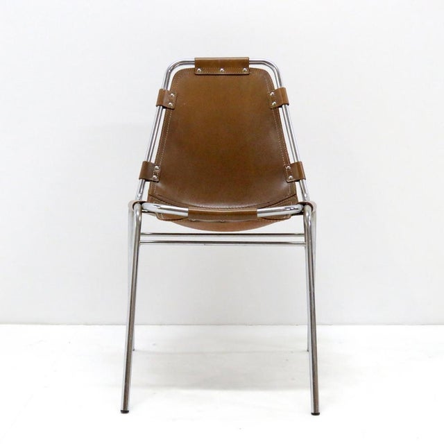 Iconic leather and metal side chair selected by Charlotte Perriand for the Ski resort Les Arcs in 1960, with chrome...
