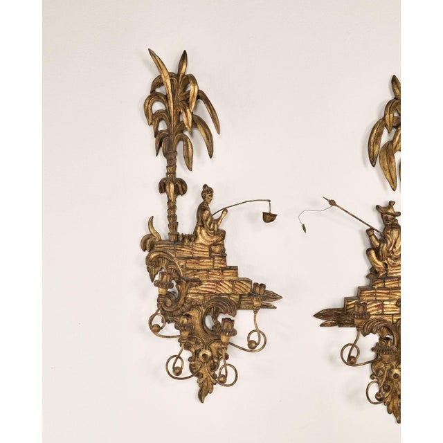 A large chic pair of vintage carved and gilt sconces, probably Italy circa 1950.