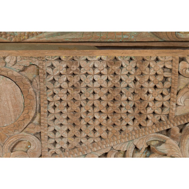 A pair of antique Indonesian carved wood overdoor panels from the 19th century, with traces of original paint. Crafted in...