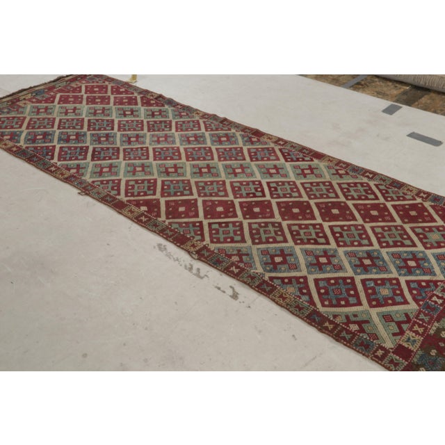Originating From Turkey In 1920, This Antique Transitional Wool Kilim Rug Features A Distinct Combination Of Rich And...