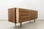 This Mid-Century Modern sideboard from Bydgoskie Fabryki Mebli in Poland, dating back to the 1960s, features a robust ash-...