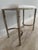 Easton metal/vinyl bench from Waterworks. Brass frame with Nickel finish and a white vinyl seat. Moisture resistant....
