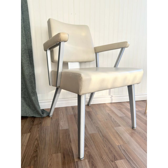 A sleek and angular industrial modern armchair made by GoodForm (a division of the General Fireproofing Company,...