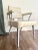A sleek and angular industrial modern armchair made by GoodForm (a division of the General Fireproofing Company,...