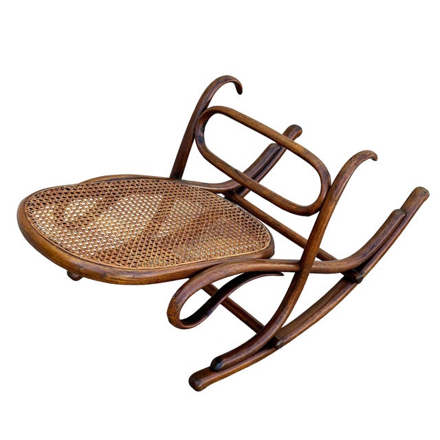 Victorian Thonet No.7001 rocking chair foot stool featuring an elegant, sculptural frame crafted from warm-toned bentwood...