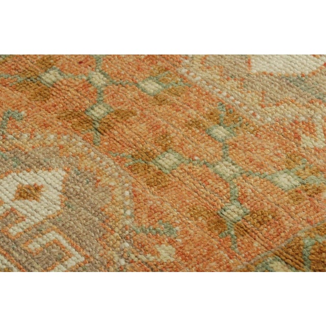 Made with hand-knotted wool, this 1x3 gift-sized vintage Turkish rug originating circa 1950-1960, is from the collection...