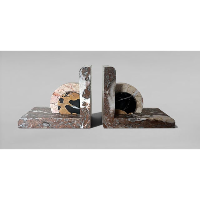 An exceptional and highly original pair of French marble bookends, masterfully crafted in the pure Art Deco style. Their...