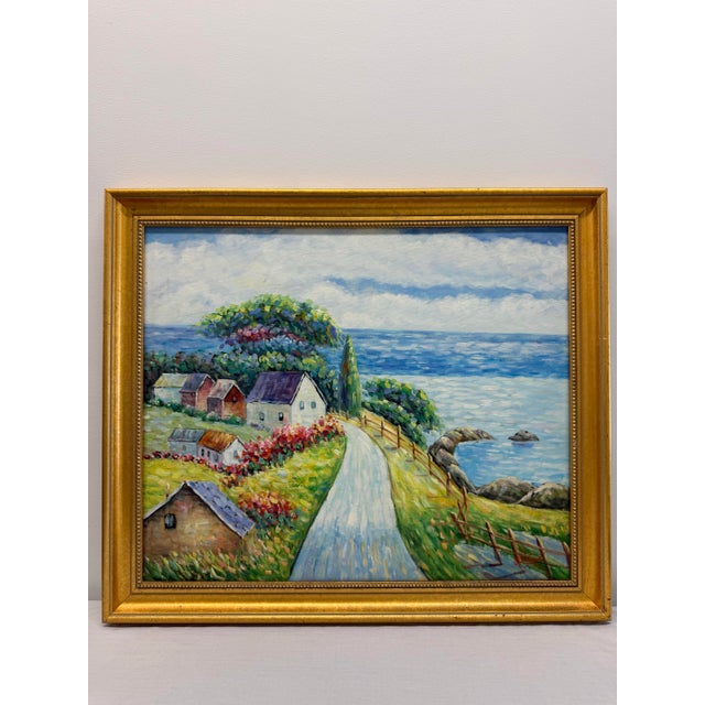 A wonderfully cheerful and richly painted coastal landscape depicting a winding lane leading past cottages and flowering...