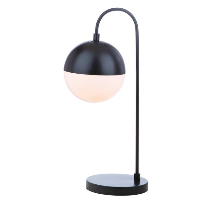 Inspired by edgy mid-century modern style, this contemporary table lamp steals the show in any living room. Designed with...