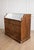A walnut chest of drawers with a marble top, likely French-made, dating back to the early 1900s. This antique chest of...