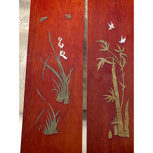 A gorgeous 3 piece set of Chinese wood panels, each beautifully inlaid with brass and mother of Pearl Flowers and birds....