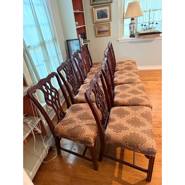 Sold as a set of 8, these solid mahogany Georgian style chairs are from the Baker Furniture Historic Charleston...