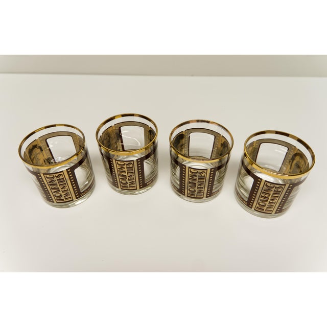 This set of four vintage 1960s lowball (Old Fashioned) whiskey glasses features a Roaring Twenties film strip design, with...