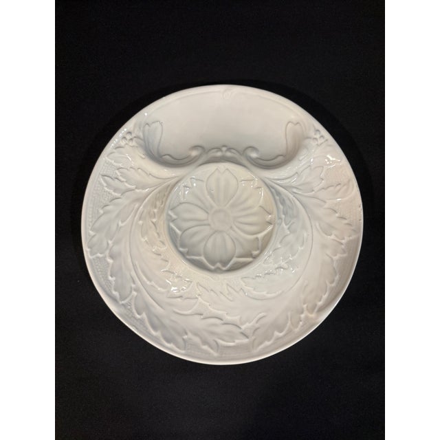 These distinctive white faience or majolica artichoke plates are beautiful and functional.