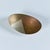 Oval Mexican dish made of copper, brass and stainless steel. The dish rests on three spherical brass ball feet. Stamped...