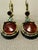 These gorgeous vintage dangle earrings feature large, oval amber-colored cabochons with a delicate hand-etched floral...