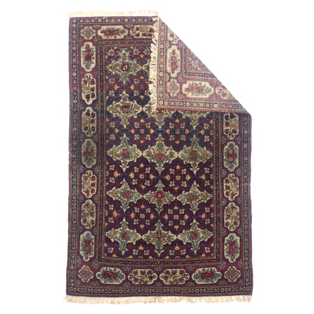 Antique Persian Tehran Rug 4'7" x 7’1". The interwar, finely woven curvilinear scatters and room sizes woven in the...