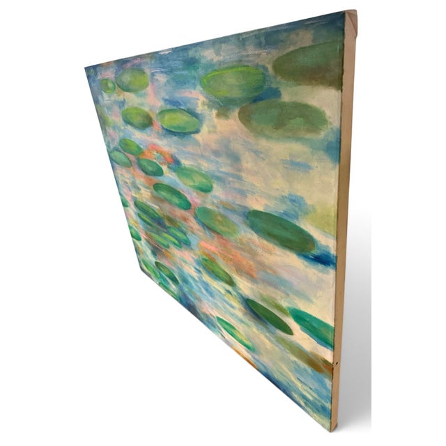 The image shows an impressionistic painting of a water lily pond with numerous green lily pads scattered across a textured...