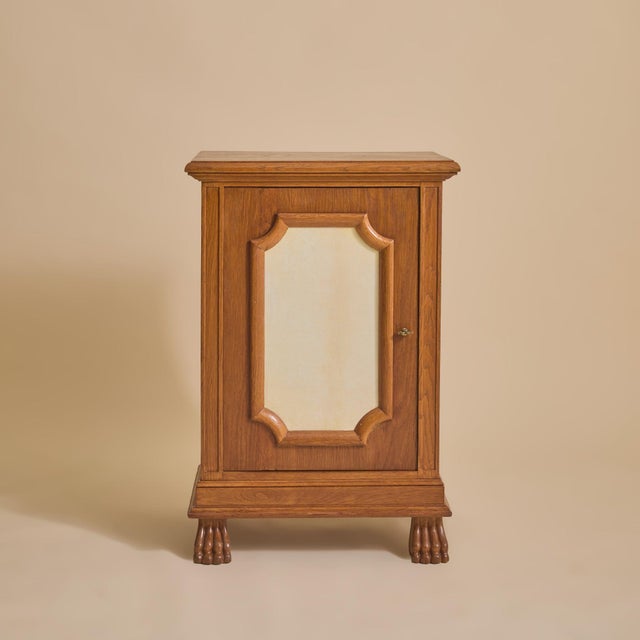 A French cabinet crafted in the manner of architect Jean-Charles Moreux, from the 1940s. The façade is defined by a single...