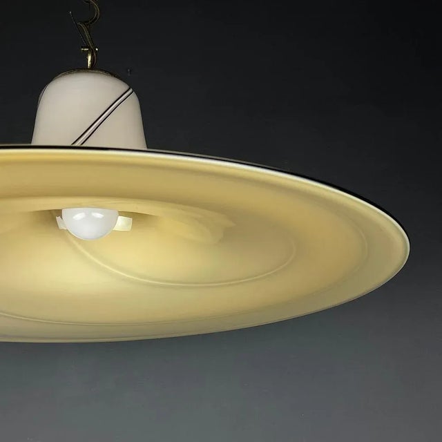 The beautiful large Murano glass chandelier. Made in Italy in the 70s. Despite its weight (5 kg), the chandelier looks...