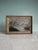 A charming antique American folk art landscape depicting a tranquil mountain lake with small fishing boats, rocky...