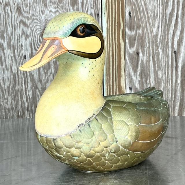 Introduce whimsical charm to your space with this vintage Boho signed Sergio Bustamante duck planter. Featuring a unique...