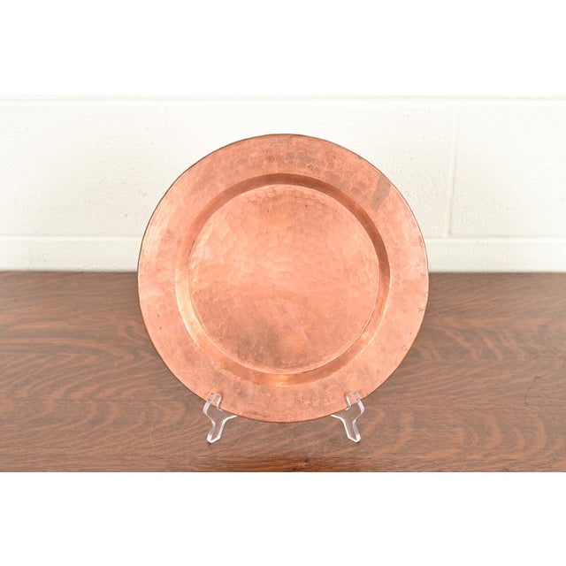 A gorgeous Arts & Crafts period hand hammered copper charger plate or tray In the manner of Roycroft USA, Early 20th...