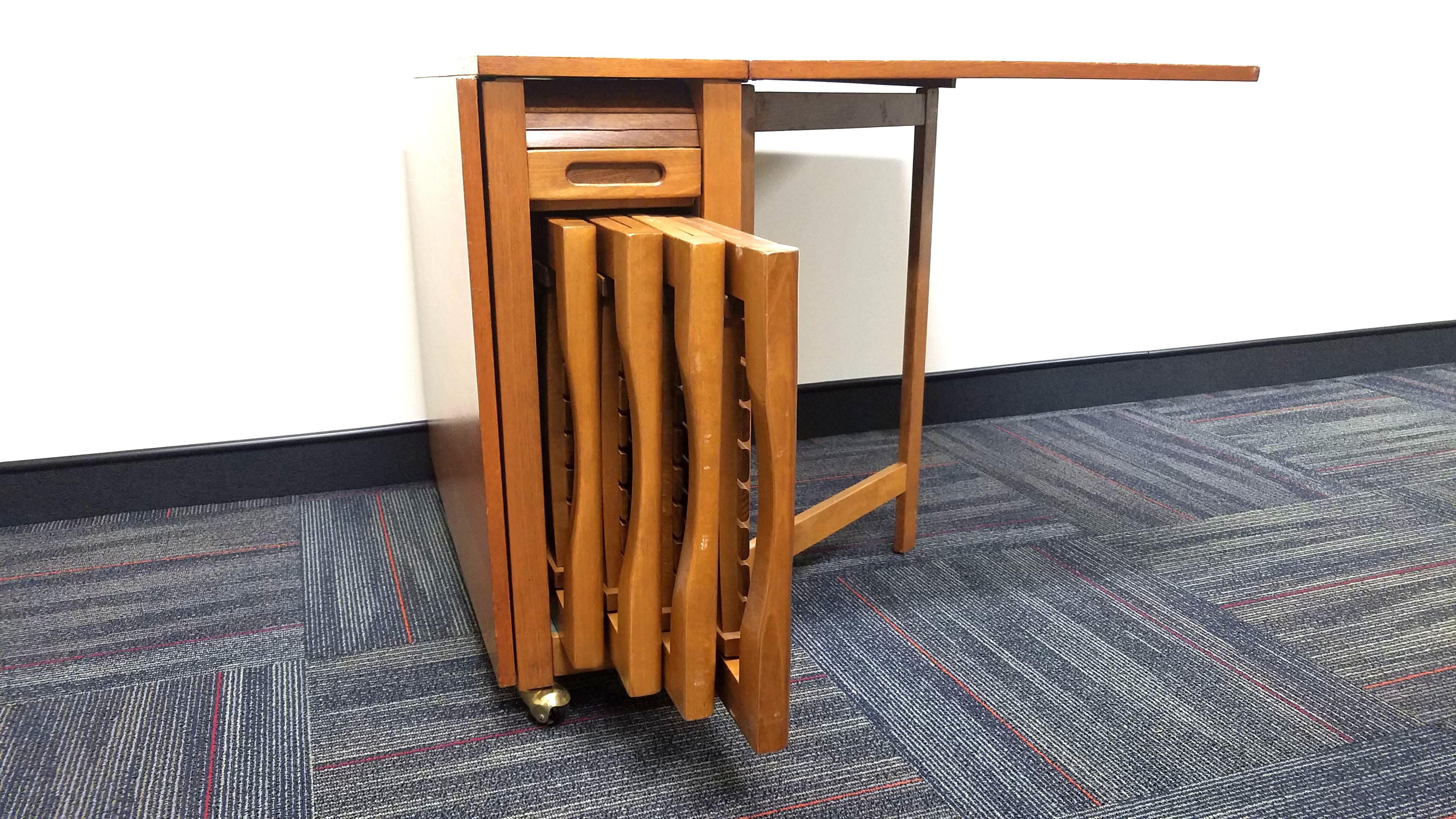 drop leaf table with chairs stored inside