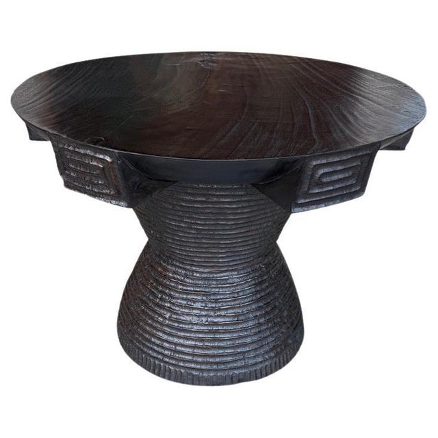 A century old mortar originally used to grind rice is repurposed into this unique side table featuring our unique...