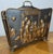 An elegant Vintage newspapper rack featuring richly embossed figural tavern scenes to both sides, creating a wonderfully...