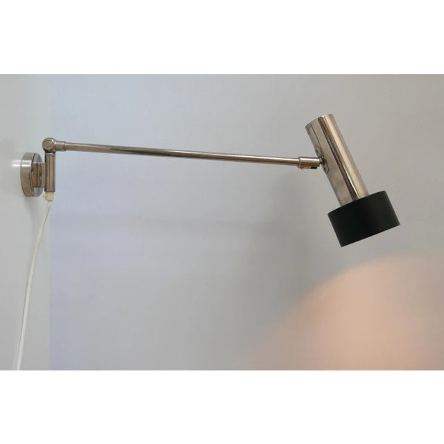 This rare and articulated wall lamp or task light was designed and manufactured by Beisl in Germany. It has an adjustable...