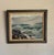This vintage 1980s oil painting of a seascape by Luella Bitterlie depicts crashing waves against a rocky outcropping. The...