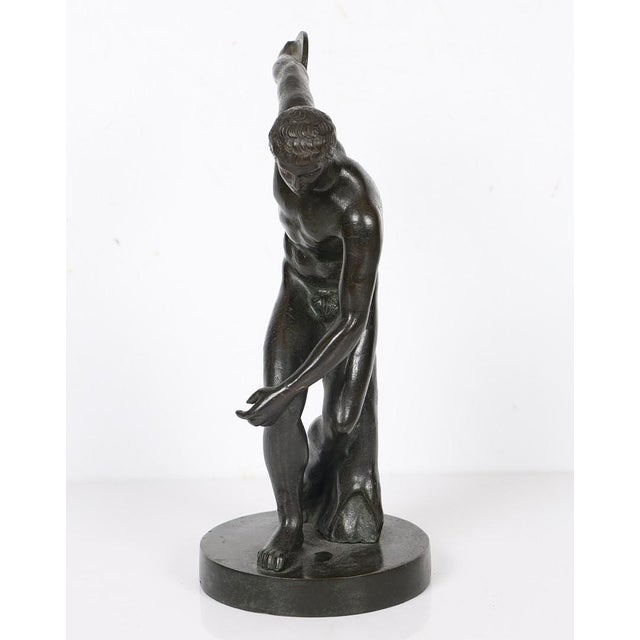 A finely cast early 19th-century Grand Tour bronze depicting the famed Discobolus (Discus Thrower), one of antiquity's...