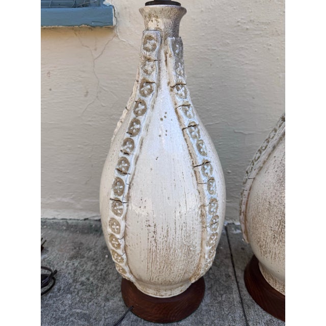 Substantial matched pair of hand-built ceramic table lamps in the Italian studio tradition, circa 1960s. Each lamp...