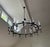 70" diameter, this is a statement-making black iron chandelier with bulbs and glass shades that glow in the evening and...