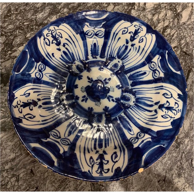 18th century hand painted Dutch delft platter- 14” diameter. Rich dark blue hand painted flower pattern.