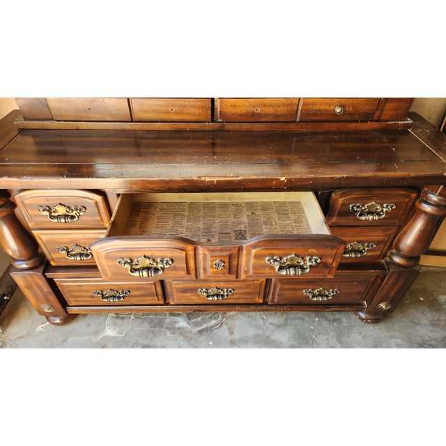 The Nomelle 1102T Dresser (11-HA) is a highly distinctive antique or vintage-style reproduction furniture piece...