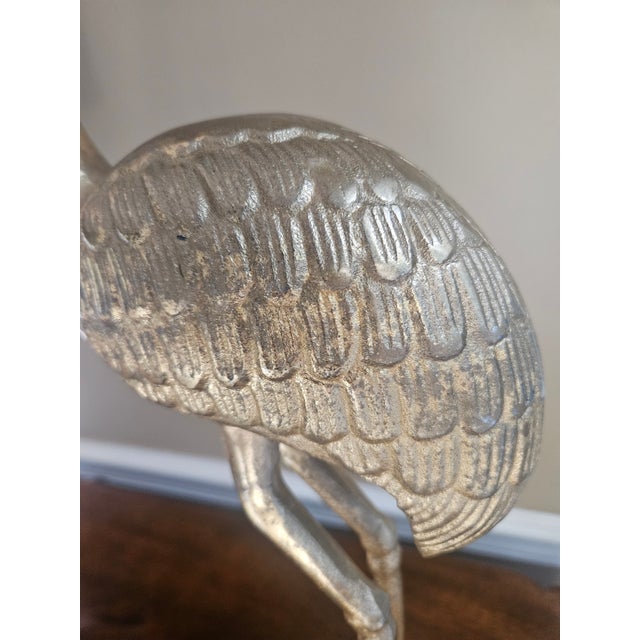 Brass flamingo sculpture with elegant, long-legged silhouette and warm, patina luster. Beautifully crafted vintage art piece