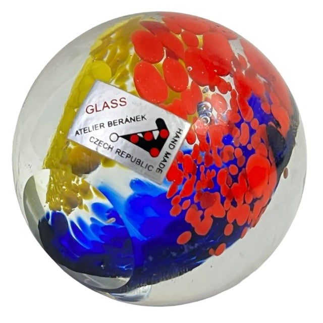 Add some vibrant color to your desk with this beautiful European hand-blown glass paperweight by Atelier Beranek. In...