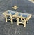 A sculptural pair of vintage coastal end tables featuring thick spun rattan construction designed to resemble twisted...
