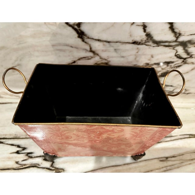 Vintage tole French motif footed jardiniere with handles.