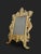 Superb rectangular gilt bronze frame mounted on two cabriole feet with a rear support. The back is fitted with glass. The...