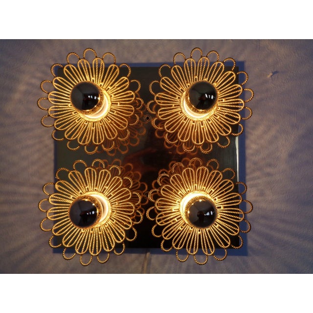 A wall or ceiling light with 4 light sources by Joseph Brumberg, Sundern, from the 1960s. We're including 3 gold-mirrored...